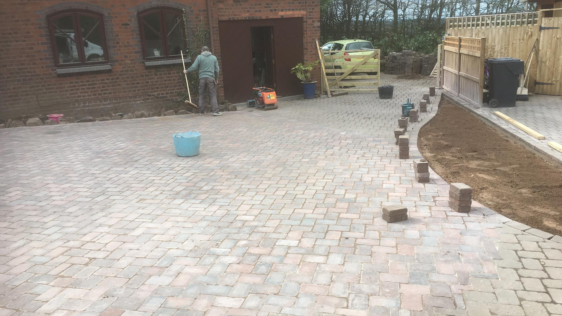 Our team finishing off a block paving task